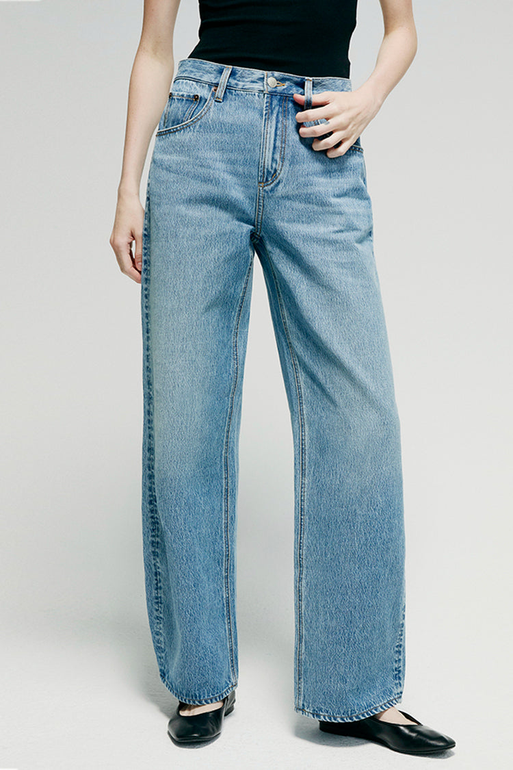 Hey Joanie Slope Curve Jeans in light denim, showing fitted high-rise design and classic five-pocket style on a white background.