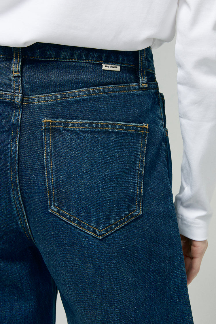 Hey Joanie Slope Curve Jeans HJ039, close-up of stylish denim with curved fit, belt loops, and classic stitching detail.