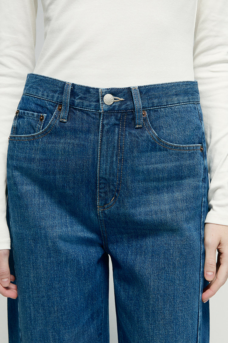 Hey Joanie Crush Curve ankle jeans in dark wash denim with a slim fit and cropped length, shown on a model.