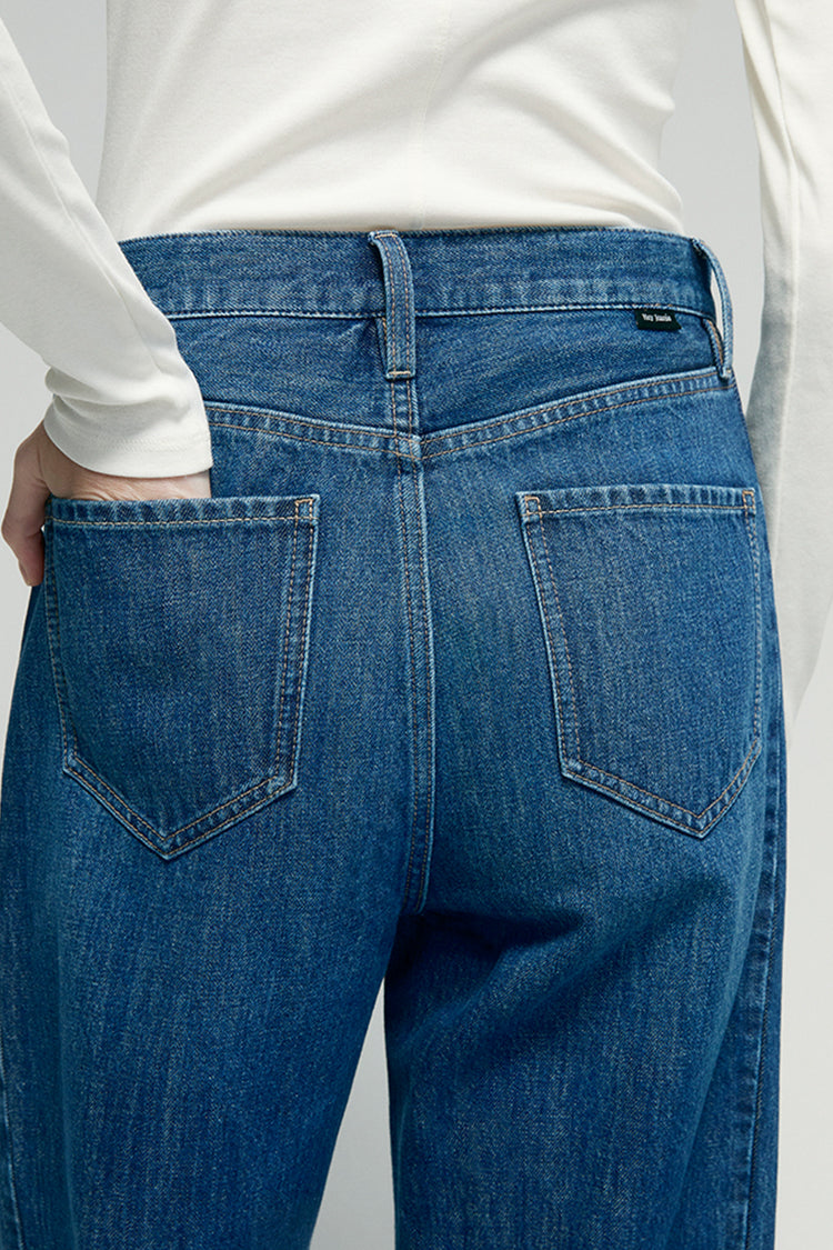 Hey Joanie Crush Curve ankle jeans in light denim with a high-rise fit and distressed details, shown on a model.