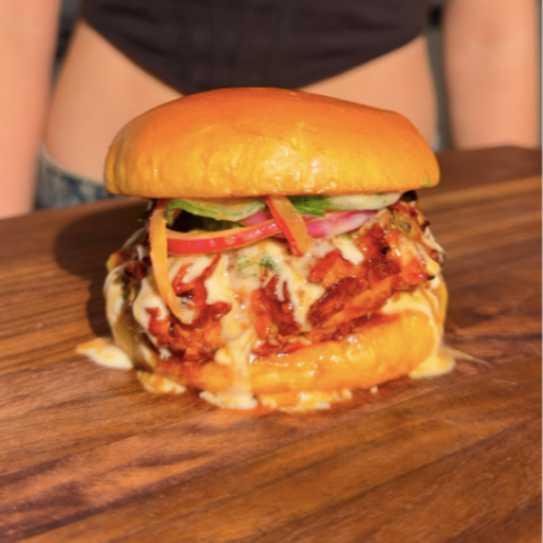 Vegan Fndly Hot Honey Fried Chicken Sandwich recipe image showing a crispy fried chicken sandwich with hot honey glaze on a bun.