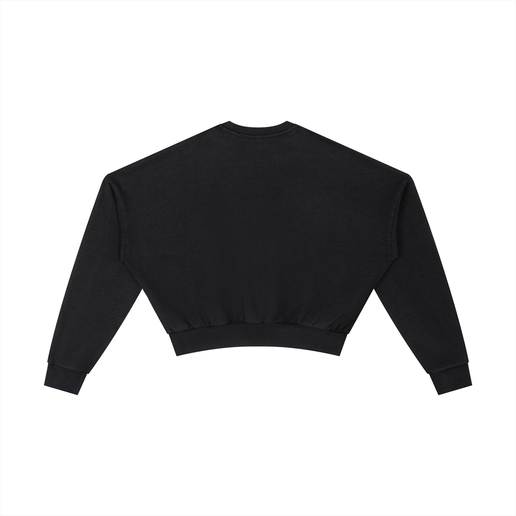 Vintage washed cropped sweatshirt by ODMPOD, showing a relaxed fit with faded fabric and casual style.