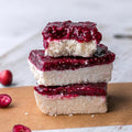 Vegan Fndly cranberry orange coconut bars recipe with vibrant cranberry, orange zest, shredded coconut, and natural ingredients.