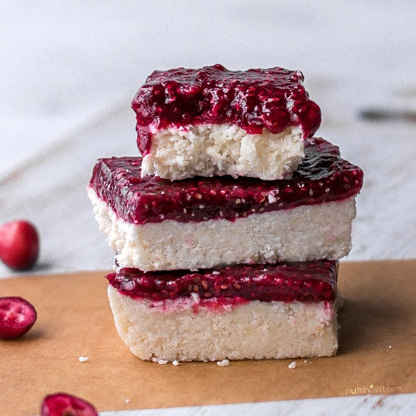 Vegan Fndly cranberry orange coconut bars recipe with vibrant cranberry, orange zest, shredded coconut, and natural ingredients.