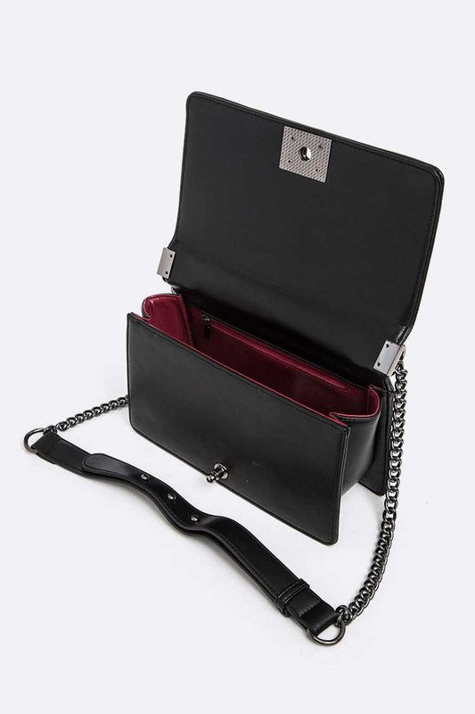 Quilted fashion shoulder handbag with stylish design and silver-tone hardware, featuring a top handle and adjustable strap.