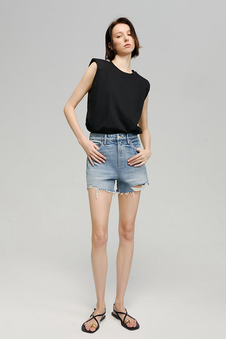Hey Joanie Sun-Kissed Vintage Cut Off Shorts in light wash denim, featuring frayed hems and high-rise fit.