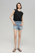 Hey Joanie Sun-Kissed Vintage Cut Off Shorts in light wash denim, featuring frayed hems and high-rise fit.