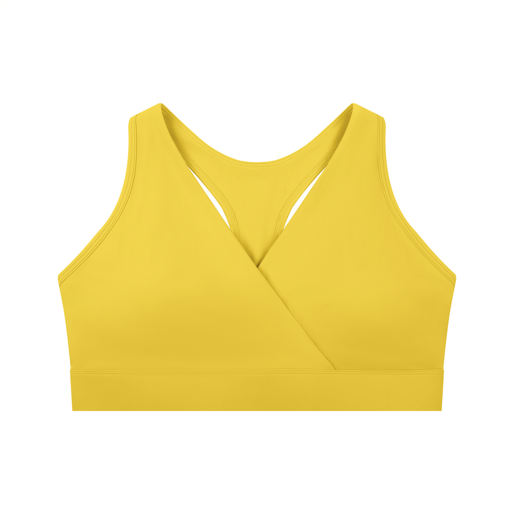 ODMPOD crossover V-neck sports bra showing supportive fit and stylish design in black fabric on a white background.