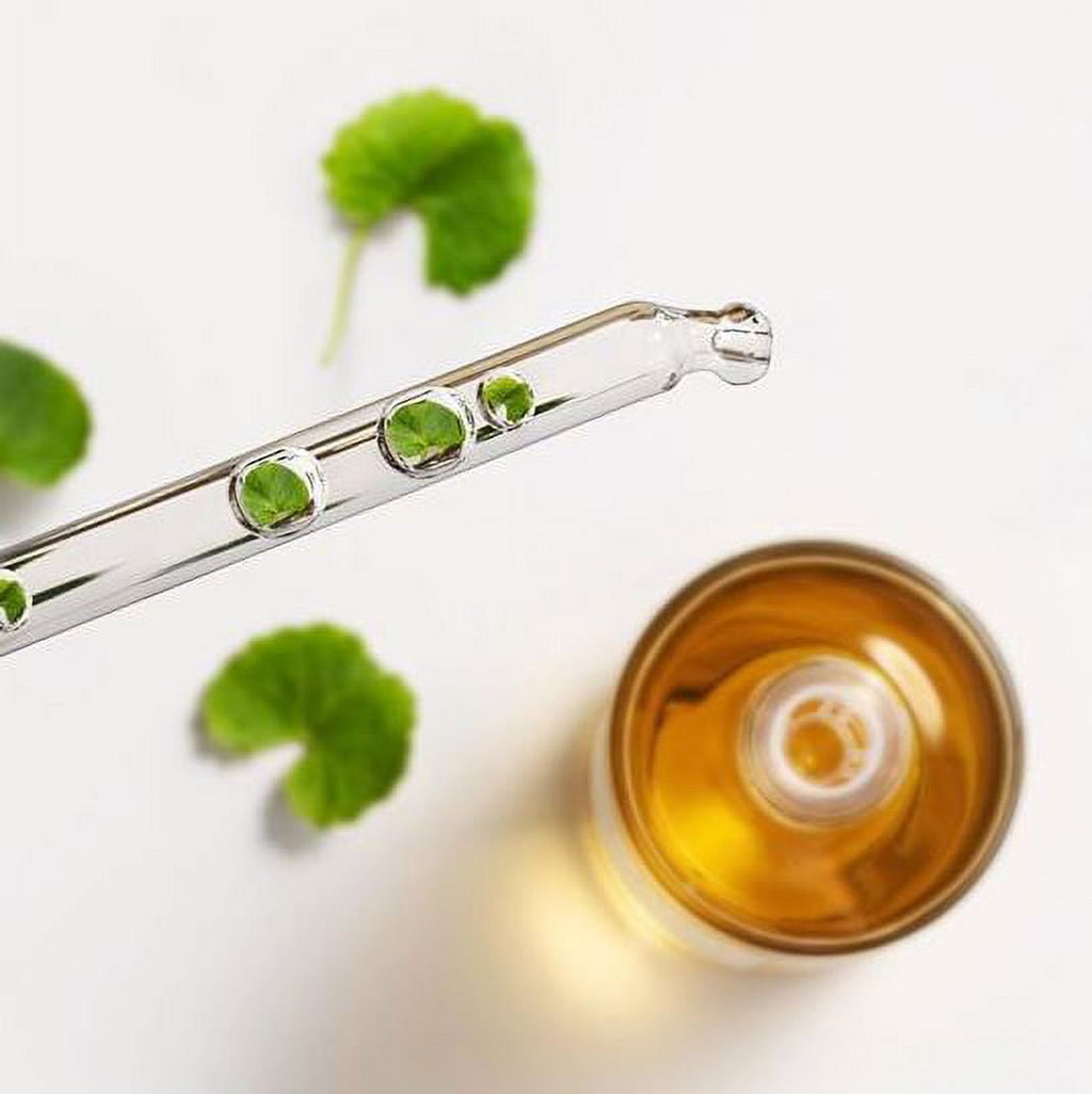 Madagascar Centella Ampoule 100ml by Korean Skin Care in a clear glass bottle with a dropper cap for skincare.