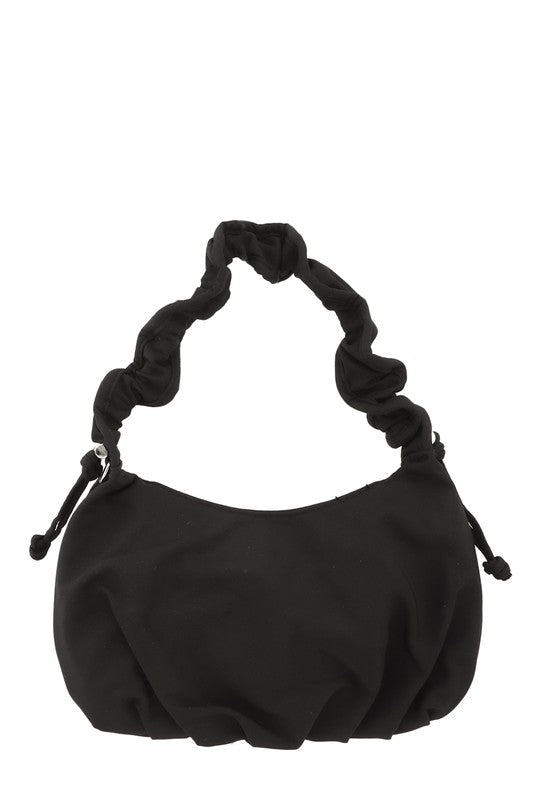 Hailey Brook Designs half moon shape crossbody handbag with sleek black leather and adjustable strap on white background
