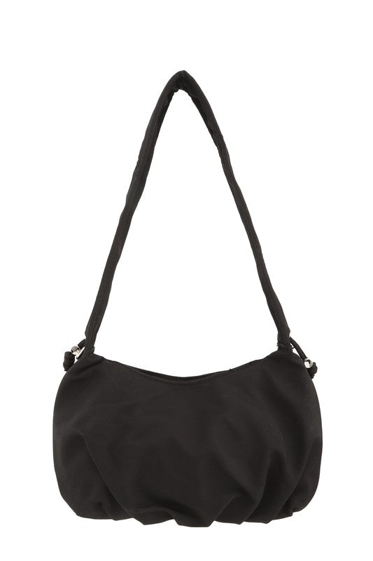 Hailey Brook Designs half moon shape crossbody handbag with sleek design and adjustable strap, shown in beige leather.