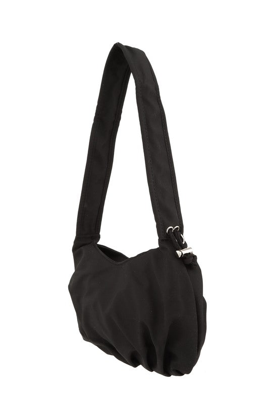 Hailey Brook Designs half moon shape crossbody handbag with adjustable strap and textured leather finish.