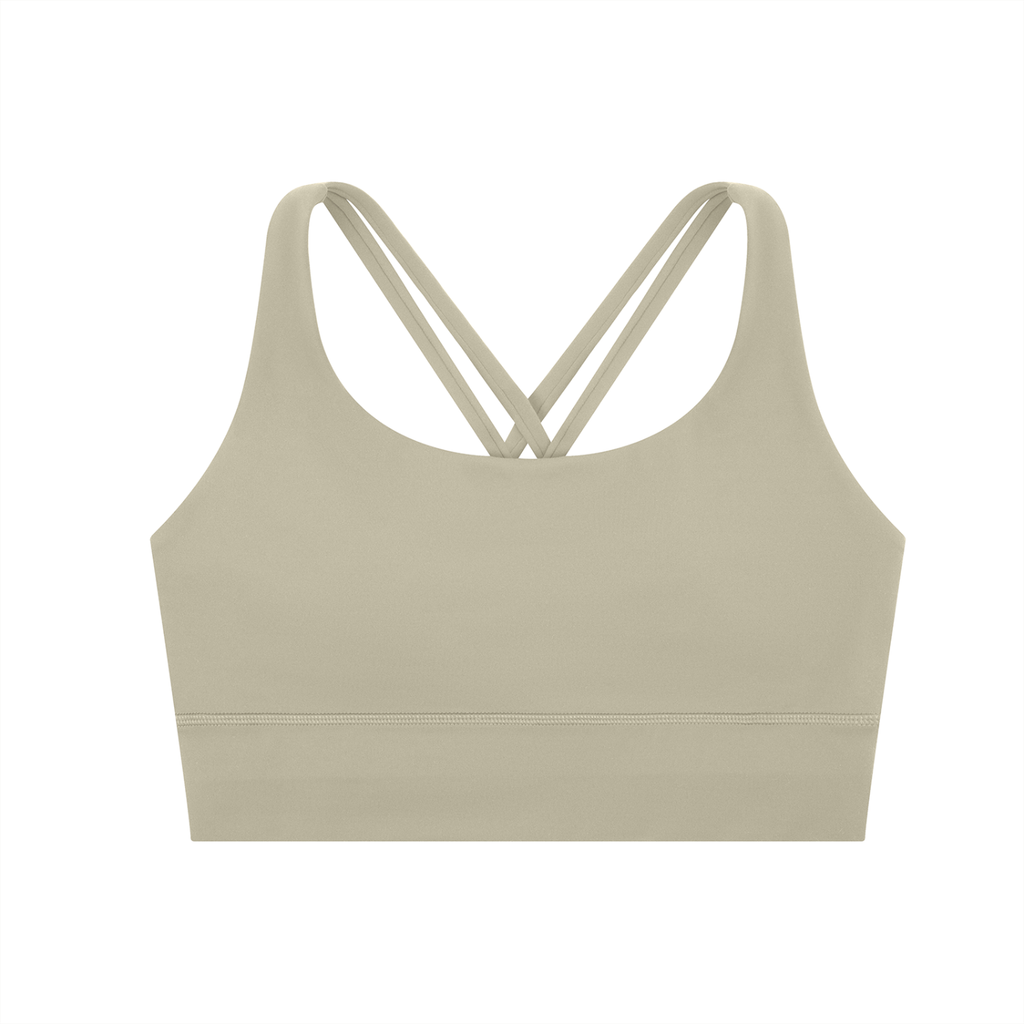 ODMPOD strappy criss-cross sports bra with adjustable straps, designed for support and comfort during workouts.