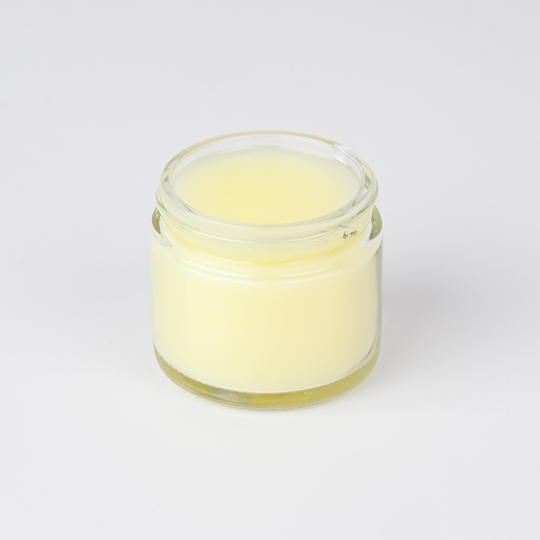 The Lady May Unscented Tallow Cleansing Balm in a 2oz jar, showing the balm's smooth, natural texture and minimalist packaging.