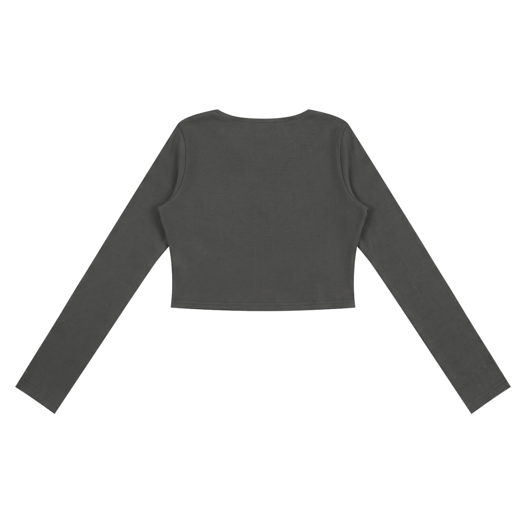 ODMPOD ruched long sleeve crop T-shirt with fitted design and gathered fabric, shown in a stylish casual setting.