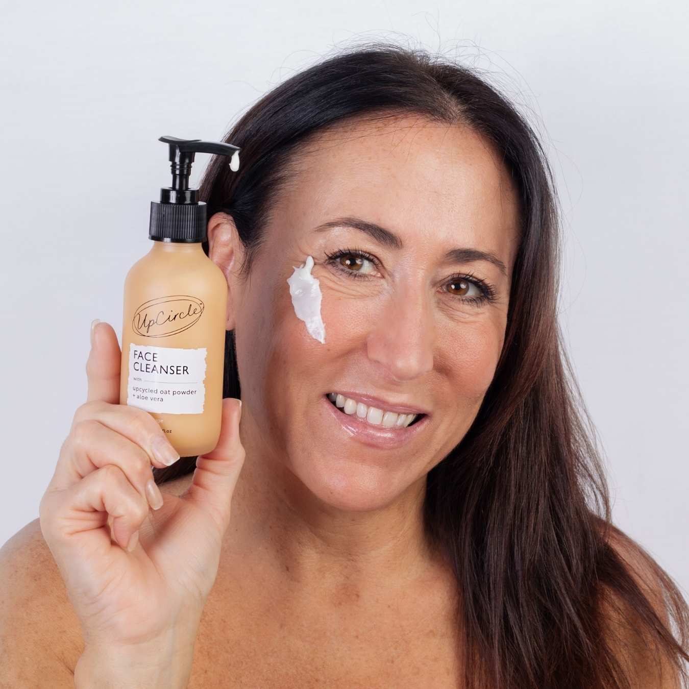 UpCircle anti-aging skincare set featuring natural creams, serums, and lotions in elegant packaging for youthful skin.