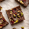 Vegan Fndly superfood brownies recipe image showing a delicious, healthy chocolate brownie topped with nuts and seeds.