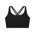 ODMPOD strappy criss-cross sports bra with stylish design and supportive fit, shown in black on a plain background.