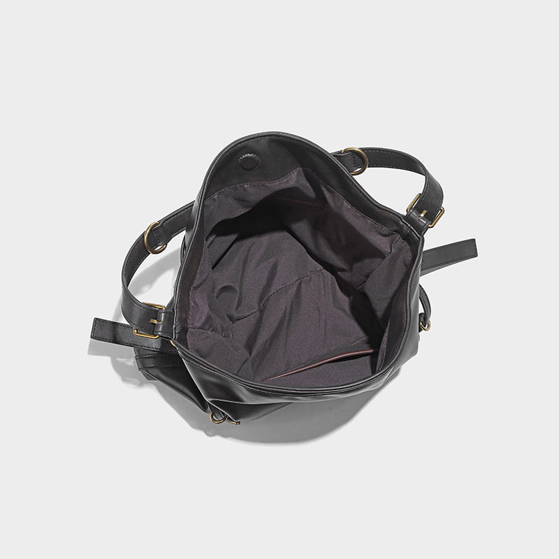 In Orderly Fashion designer shoulder handbag with stylish leather exterior and gold-tone hardware, featuring a spacious interior.