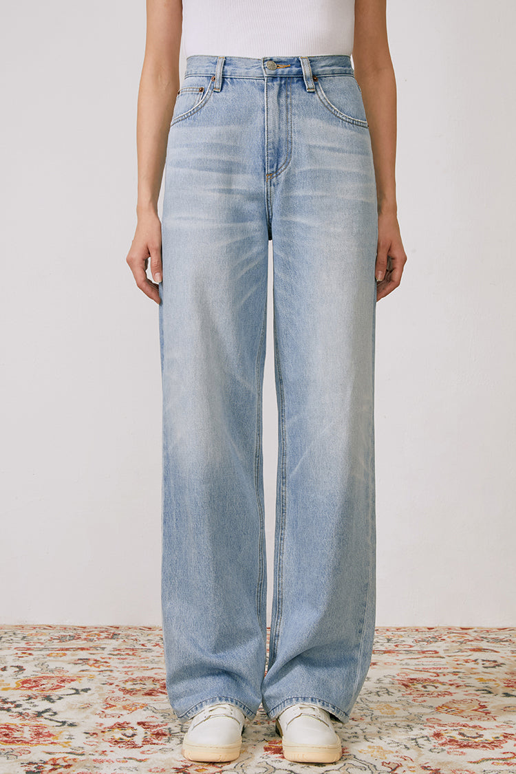 Hey Joanie Coney Island Whitefish high-rise wide-leg jeans displayed on a model, showcasing the relaxed fit and stylish silhouette.