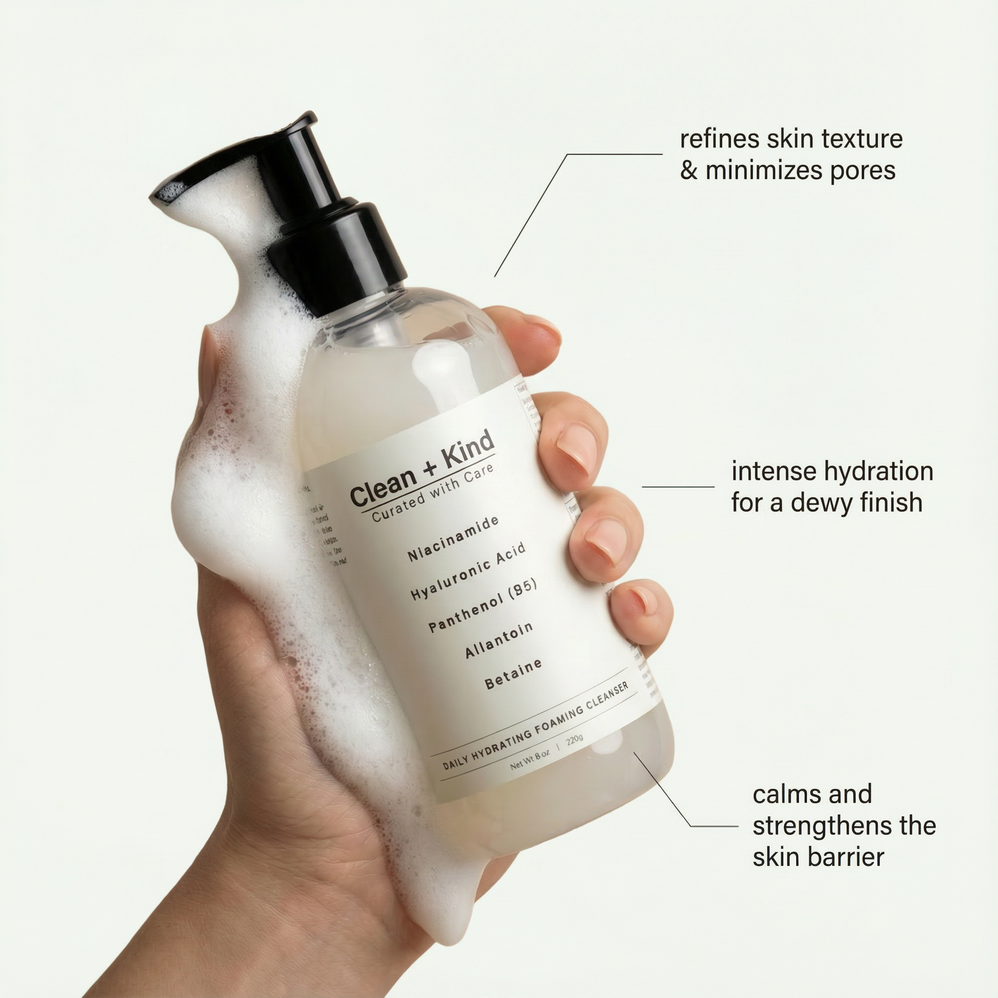 Clean + Kind Daily Facial Cleanser bottle with pump dispenser, showing the label and product packaging.