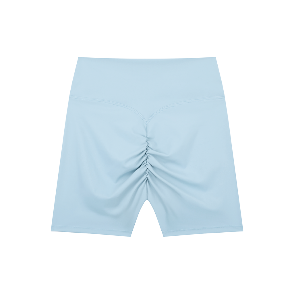 Black high-waisted blend biker shorts by ODMPOD, close-up of the fitted stretch fabric and elastic waistband.