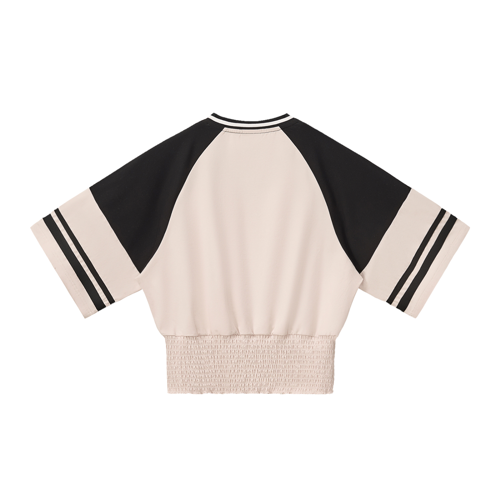 Color block ruched ODMPOD T-shirt with vibrant panels and gathered detail, displayed flat on a white background.
