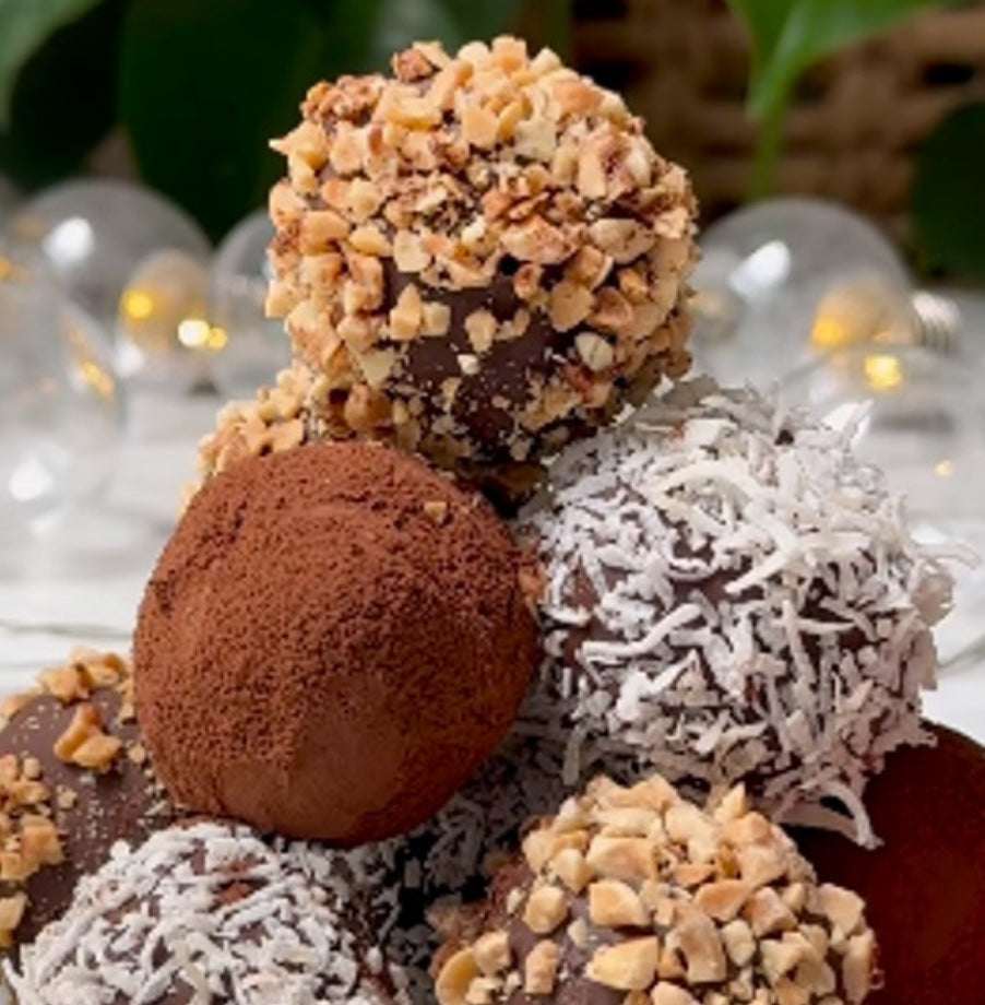 Vegan Fndly 5-ingredient rice cake truffles recipe image showing prepared vegan rice cake treats on a plate with ingredients in the background.