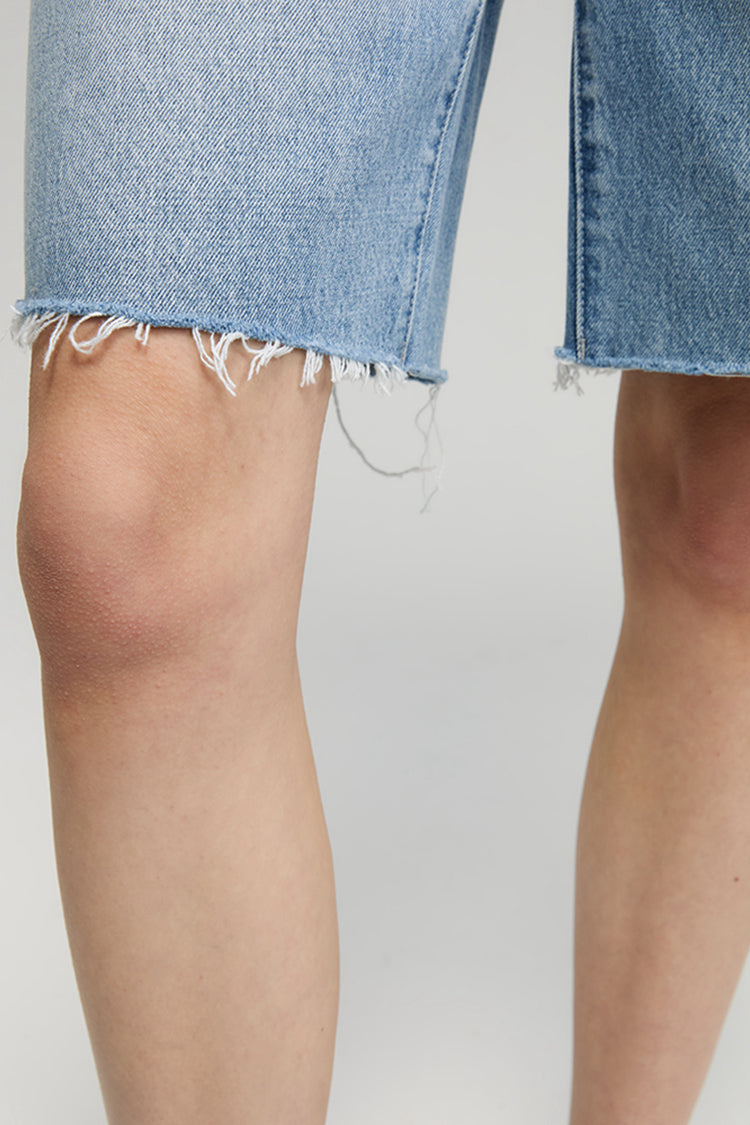 Hey Joanie Coastal Breeze 90's Bermuda Shorts in light blue, high-waisted with a relaxed fit, denim fabric, and rolled hems.