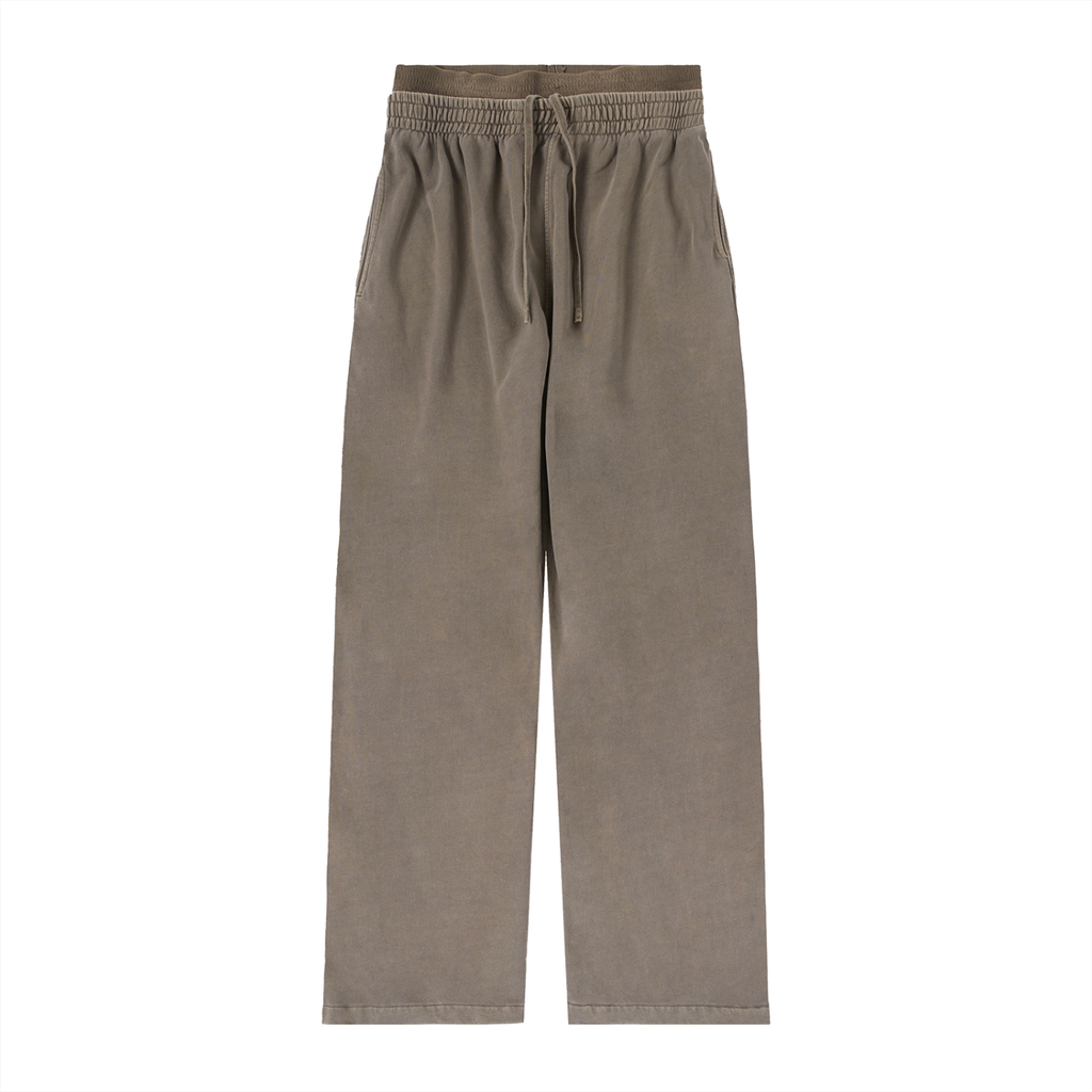 ODMPOD vintage washed sweat pants with a relaxed waist fit, featuring a casual, faded denim-style design and comfortable fabric.