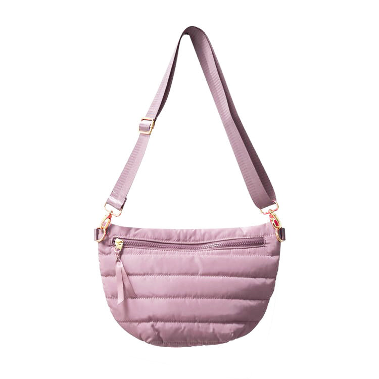 Babs+Birdie Crescent Puffer Sling Bag in beige with adjustable strap and quilted puffer design for casual style.