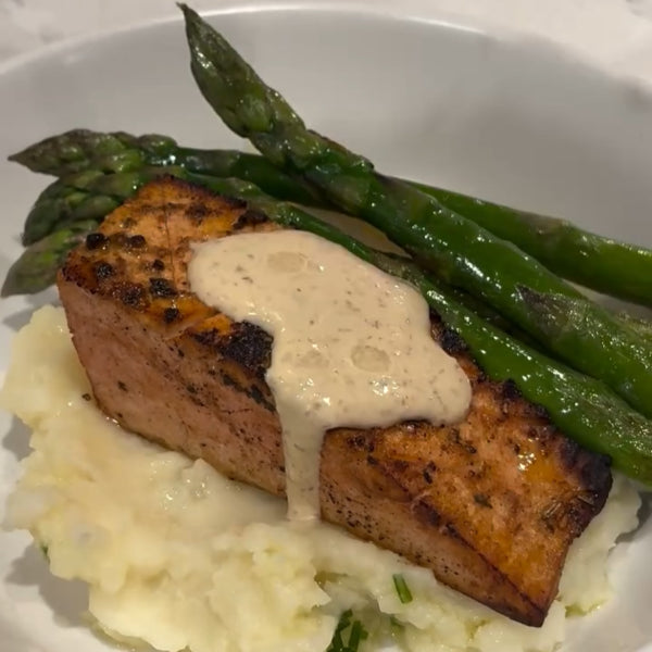 Vegan Salmon Fillets Recipe from Vegan Fndly, featuring prepared plant-based salmon fillets on a wooden cutting board.