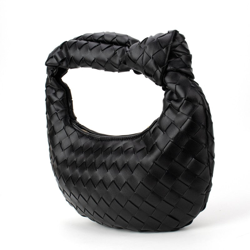 Black woven knotted handbag by Babs+Birdie featuring a stylish, textured woven design with a knotted accent.
