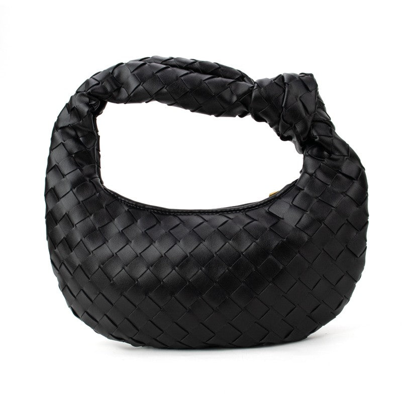 Black woven knotted handbag from Babs+Birdie’s Charlize collection, featuring a stylish handwoven design and knotted details.