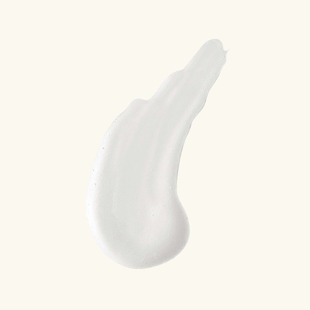 Gleamin Clarifying Brightening Cleanser facial cleanser with swatch showing its creamy texture and light color.