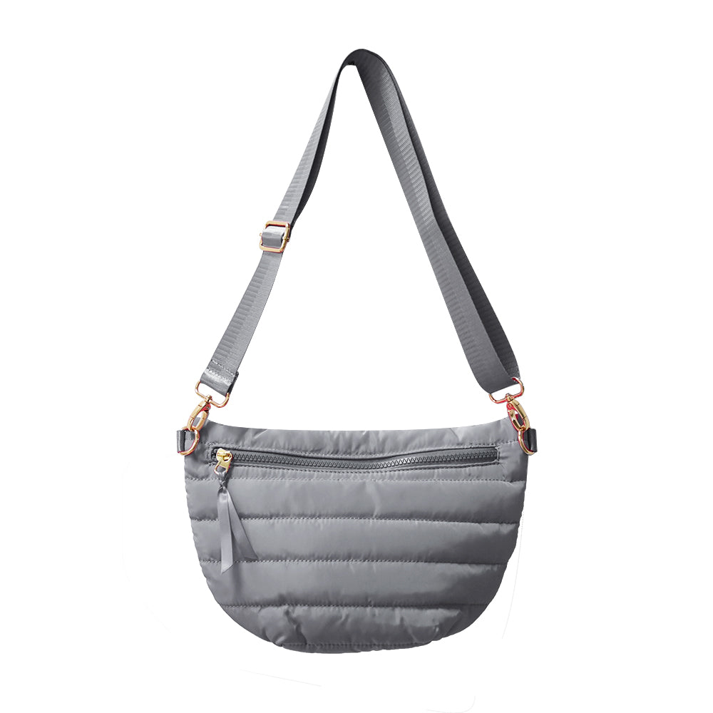 Babs+Birdie Crescent Puffer Sling Bag in quilted design with adjustable strap, stylish accessory for casual or evening wear.