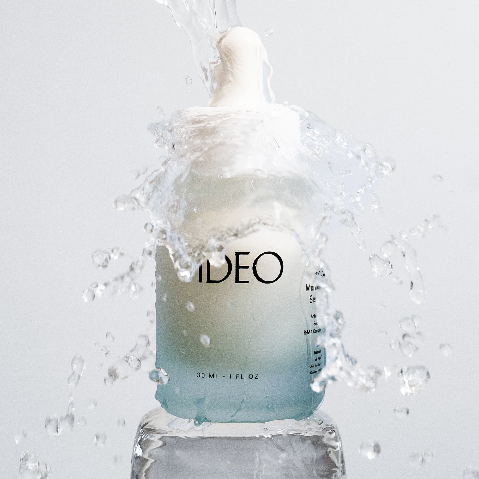 IDEA Skincare Skin Memory Face Serum bottle with dropper, close-up of the serum product on a neutral background