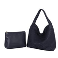 Large woven vegan leather tote bag by Babs+Birdie featuring a spacious design with sturdy handles and stylish woven texture.