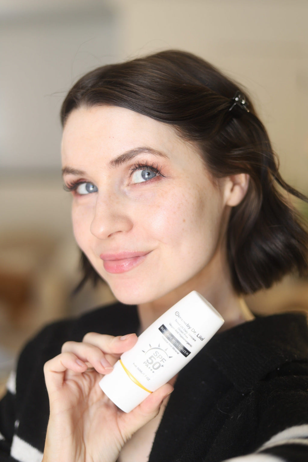 EpiLynx SPF 50 mineral moisturizer tube with hydrating, vegan, sensitive-skin friendly suncare formula on a white background.