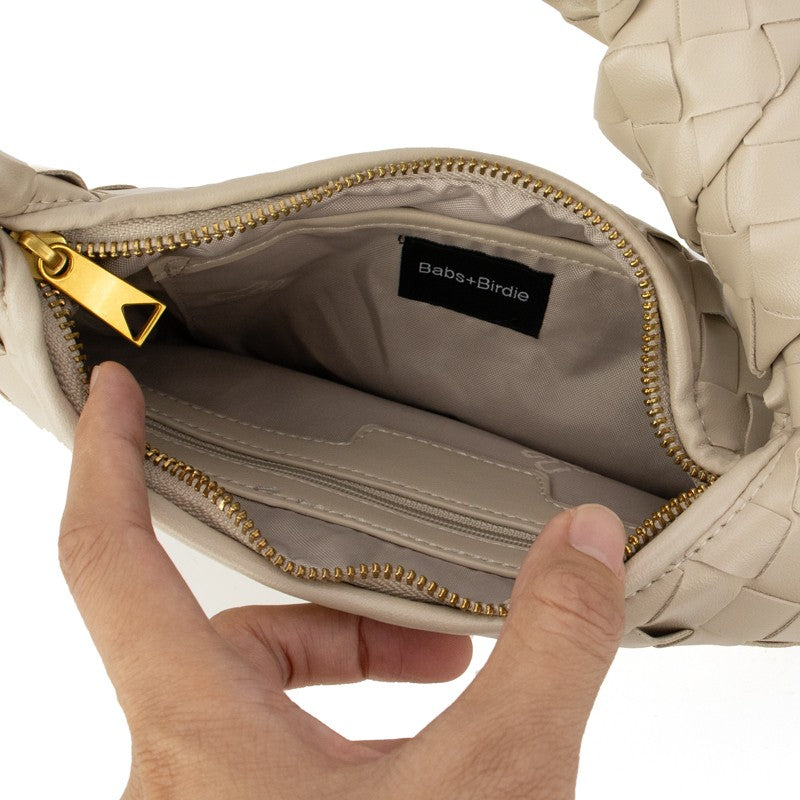Khaki woven knotted handbag from Babs+Birdie’s The Charlize collection, featuring a stylish, textured interior design.