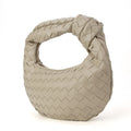 Khaki knotted woven handbag by Babs+Birdie, The Charlize, featuring a stylish handwoven design and knotted detailing.