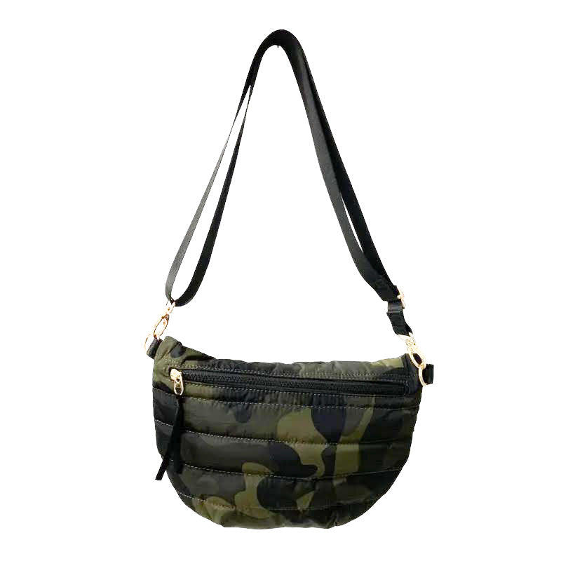 Babs+Birdie Crescent Puffer Sling Bag with quilted design and adjustable strap, shown in a stylish puffer style.