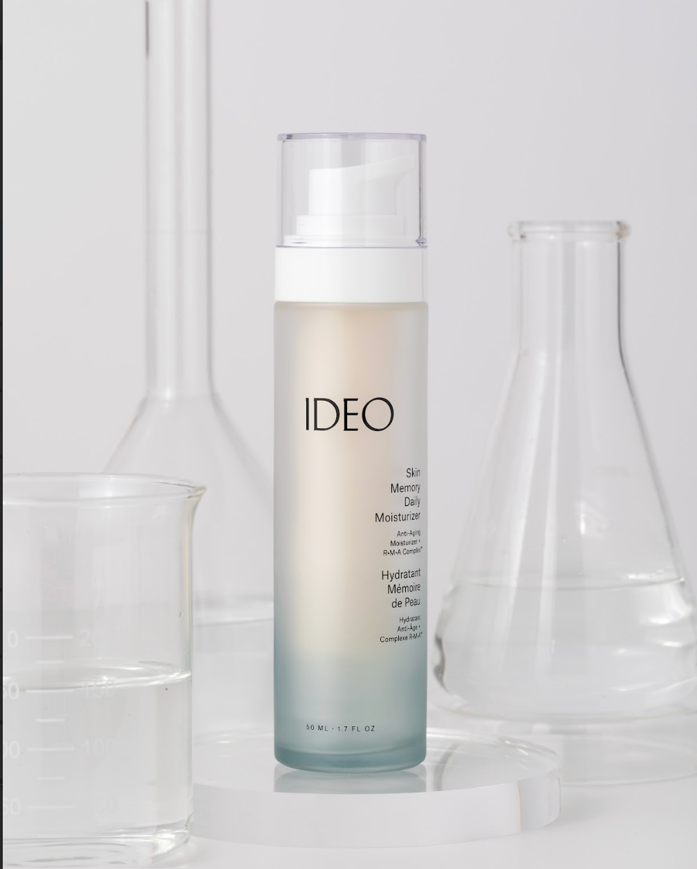 IDEOSkincare Skin Memory Daily Moisturizer in a sleek bottle, showing the moisturizer's smooth, hydrating texture.