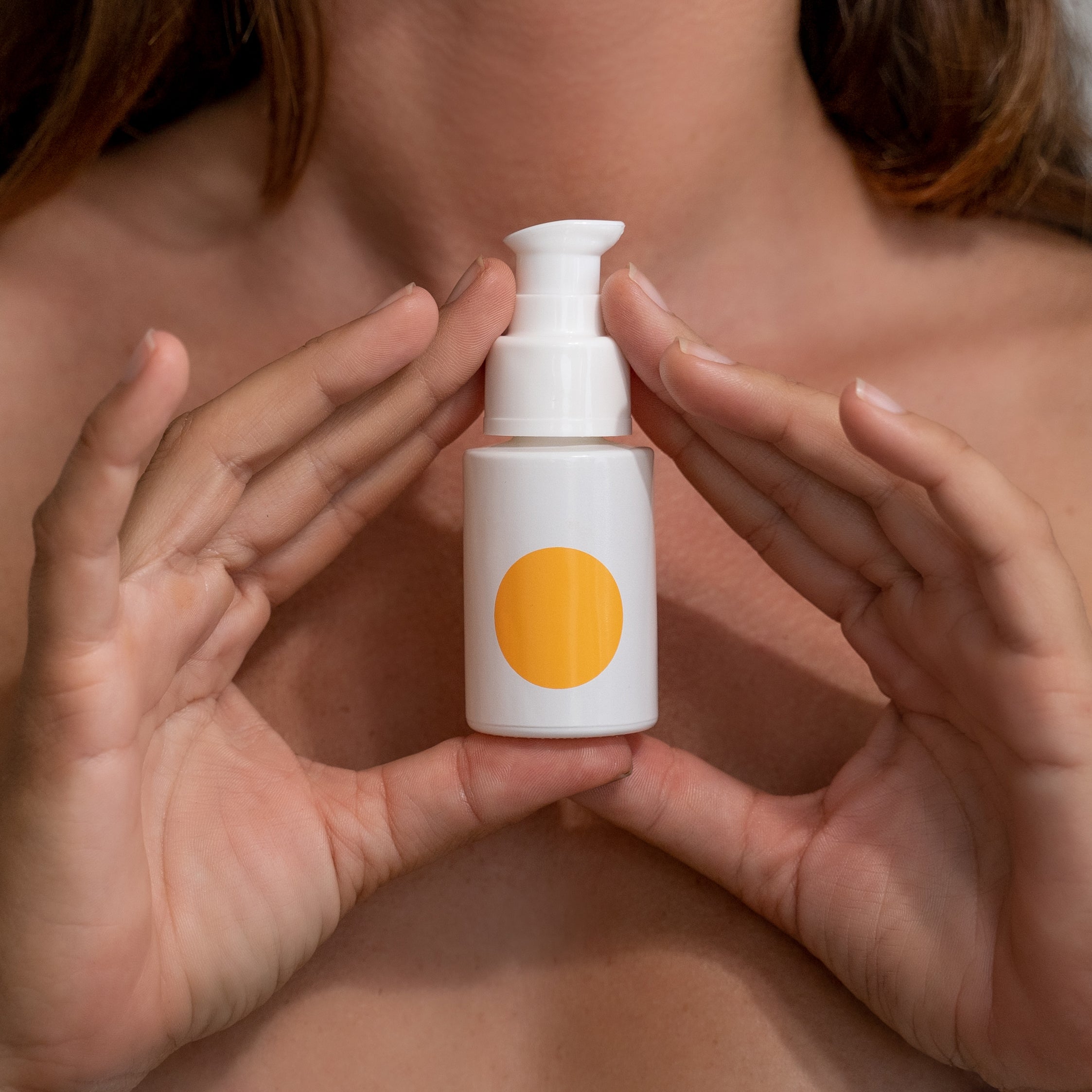 Somme Institute anti-aging face serum in a 1-ounce bottle, showcasing smooth, youthful skin and sleek packaging.