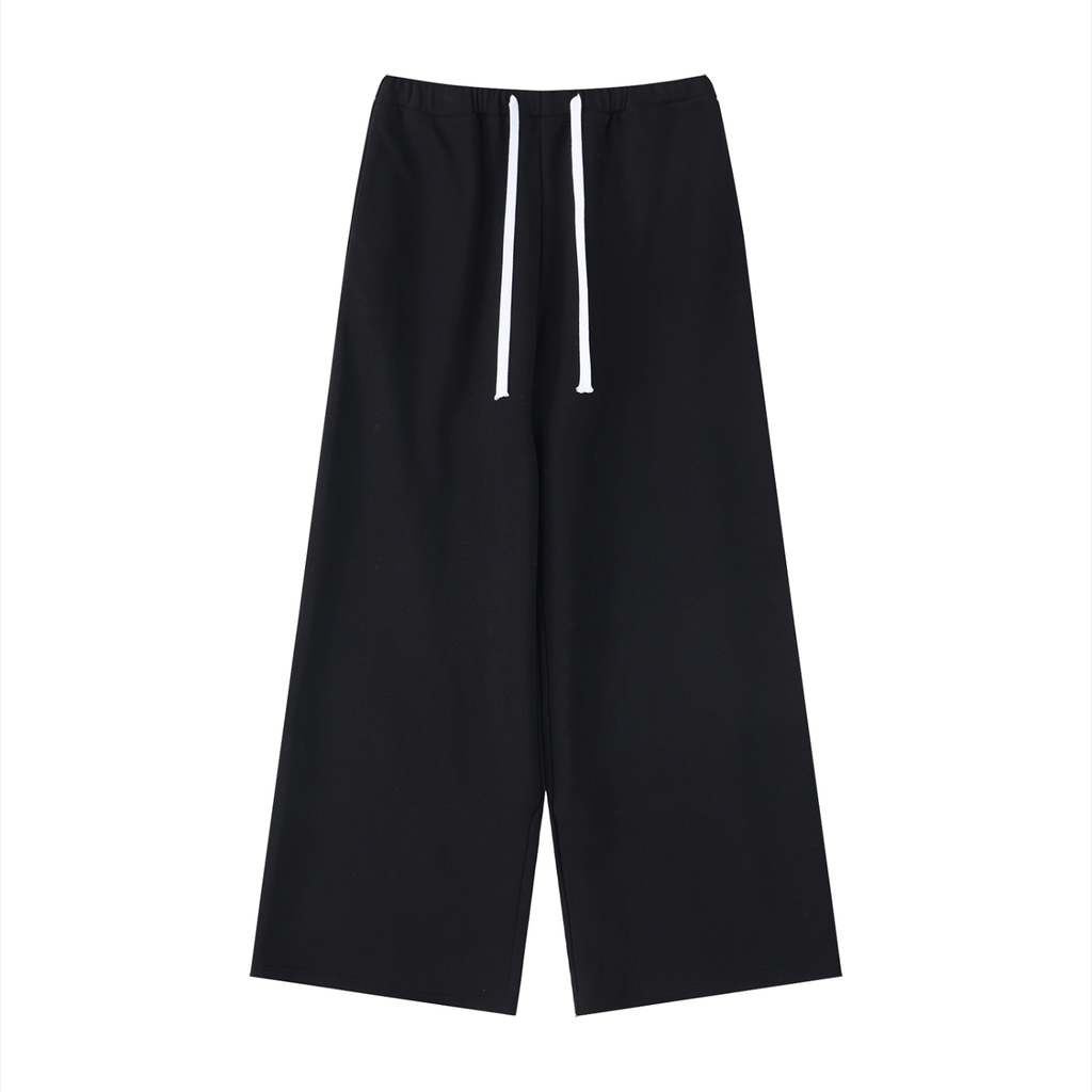 ODMPOD wide leg sweatpants, comfortable relaxed fit with elastic waistband and cuffs, shown in soft fabric on a neutral background.