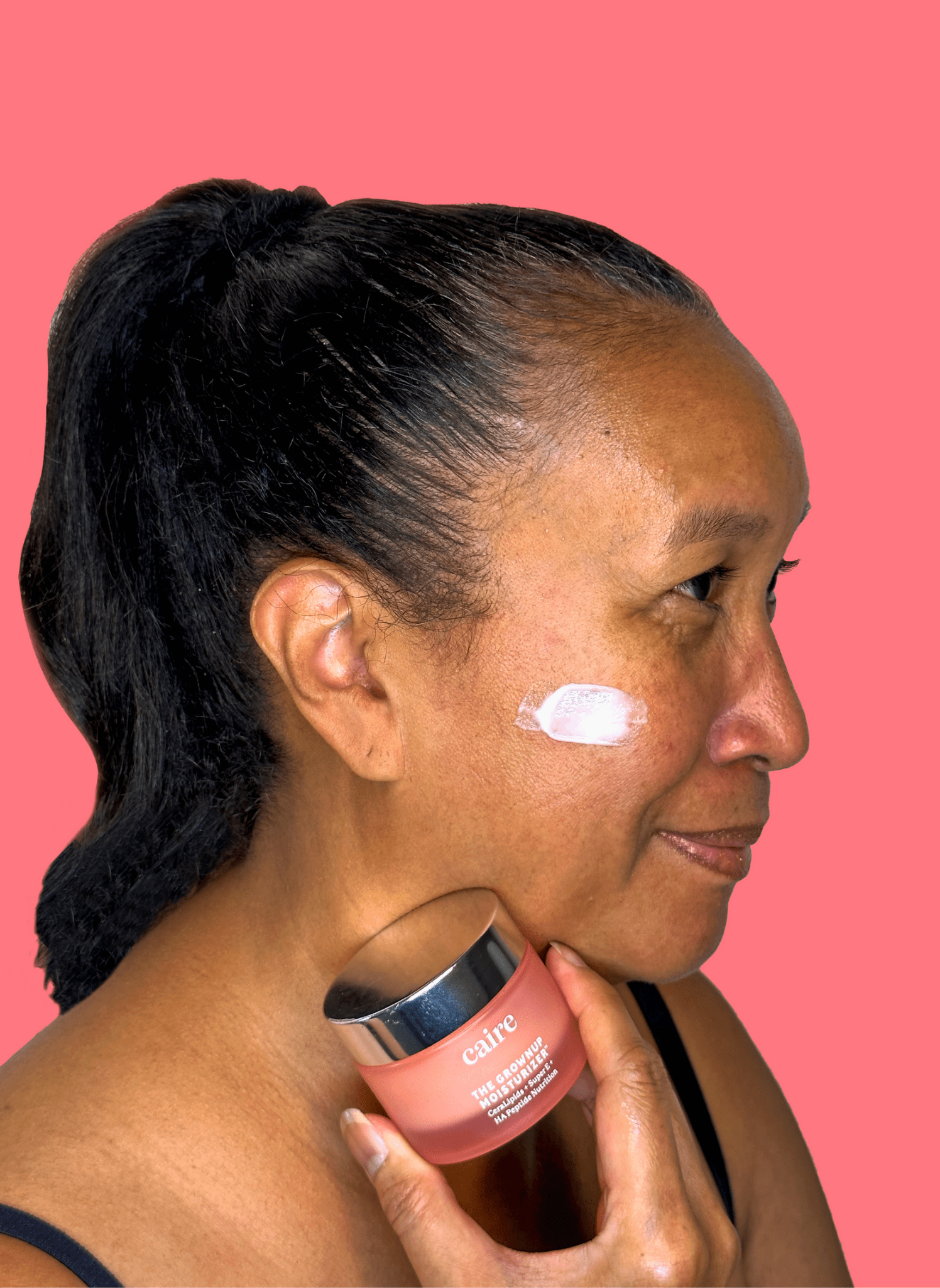 Caire Beauty moisturizer for mature skin, featuring a sleek jar with a creamy skincare product for aging skin care.