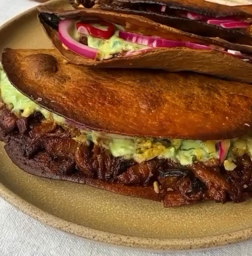 Vegan Fndly crispy baked pulled pork taco recipe with shredded plant-based pork, fresh toppings, and crunchy taco shell.
