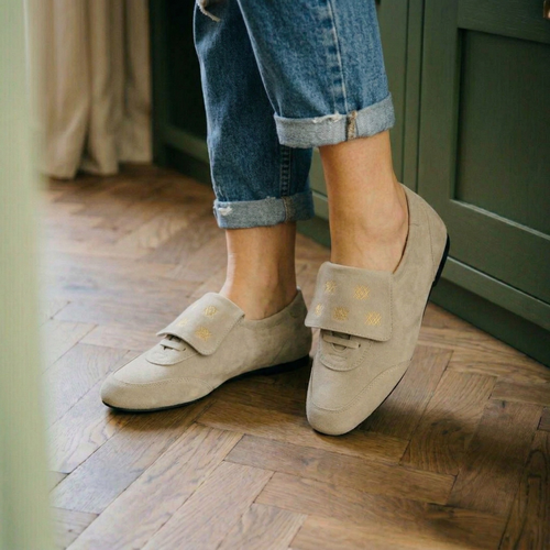 Amie Rafa Chelley Suede Sneakers showing beige suede shoes with white soles and laces on a neutral background.