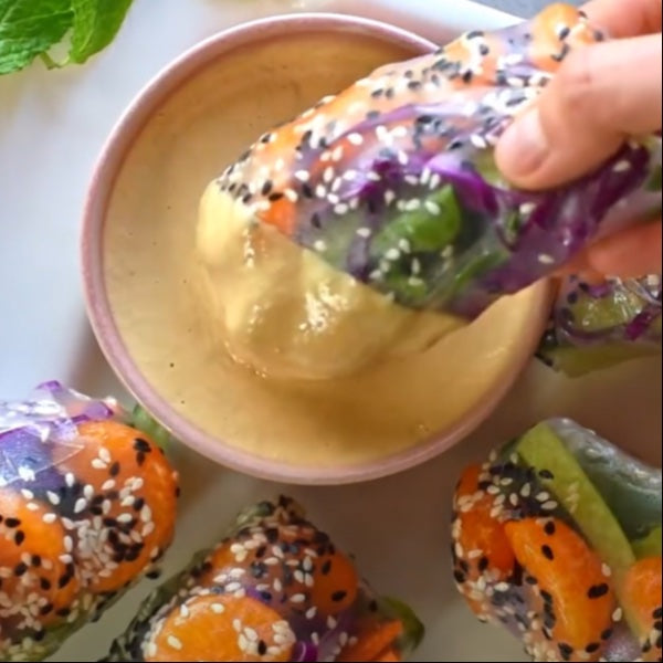 Vegan Fndly Mandarin Spring Rolls recipe image showing fresh spring rolls with vibrant vegetables and dipping sauce.