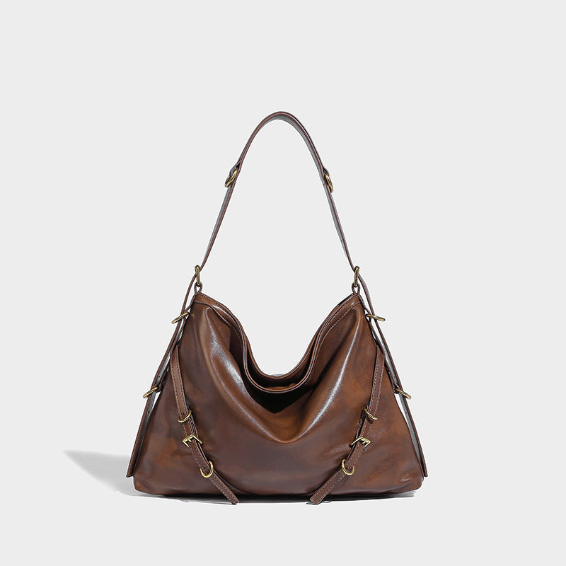 In Orderly Fashion designer shoulder handbag featuring a stylish bag with a sleek design and elegant straps.